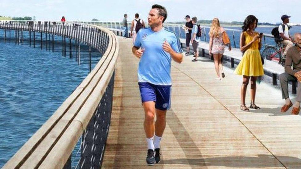 A CGI image of a bridge in a park. Some people have been edited into the image, among them is Frank Lampard.