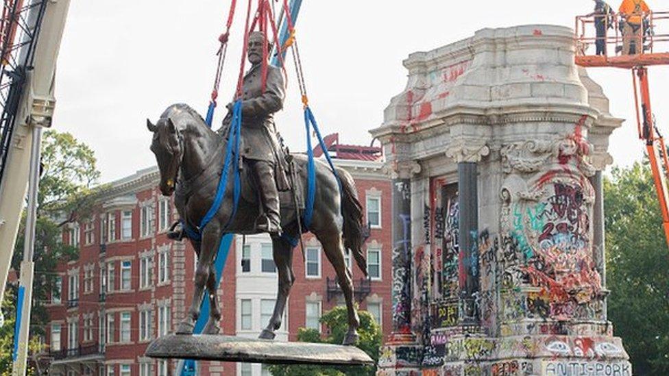 A statue of Confederate General Robert E. Lee being removed by authorities in September.