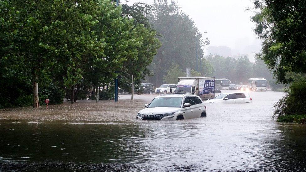 Cars stuck in flooded roads