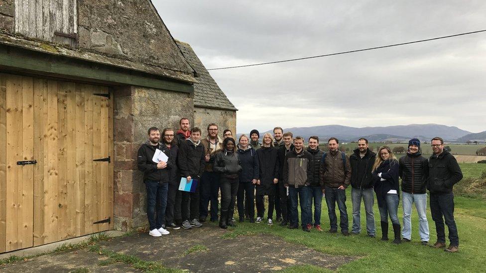 Students at site of mill