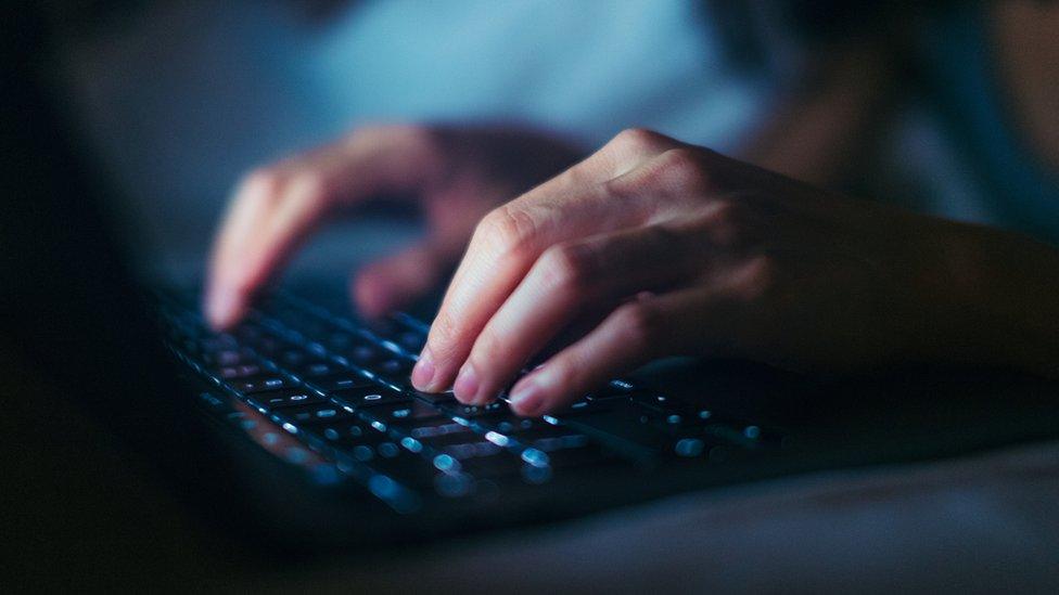 A woman using a laptop