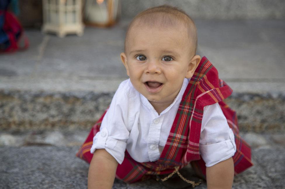 A baby wearing tartan in Gurro