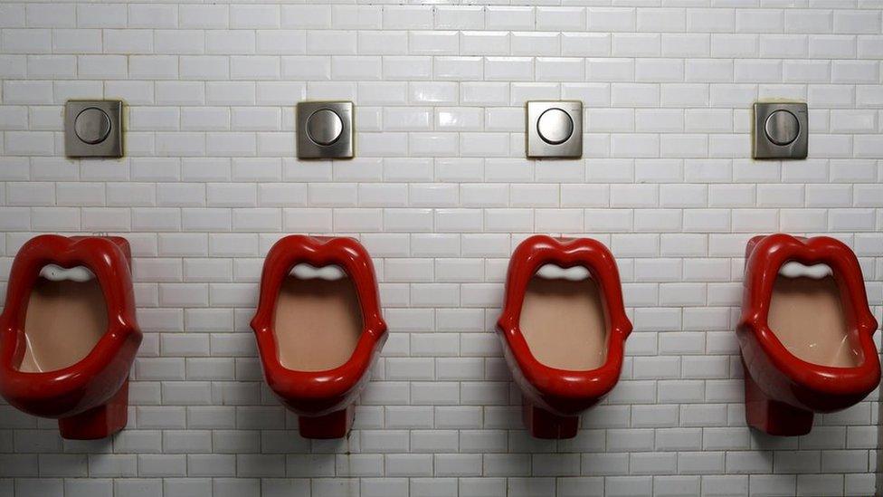 Urinals inspired by the Rolling Stones lips and tongue logo are seen in a bar in Paris