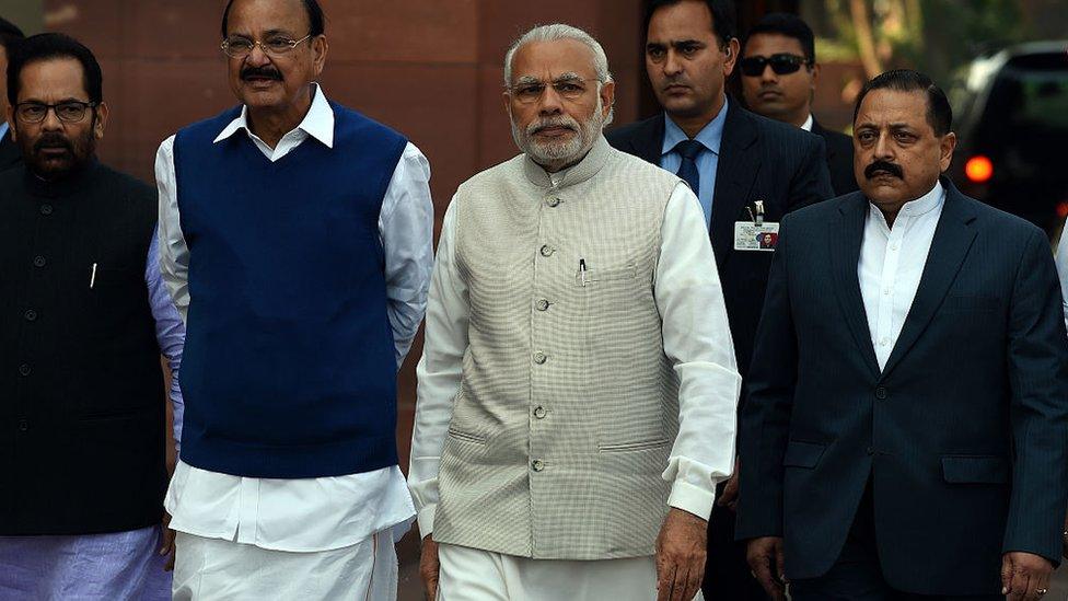 Indian Prime Minister Narendra Modi (centre R) arrives at the Indian Parliament for the opening of the budget session in New Delhi on February 23, 2016