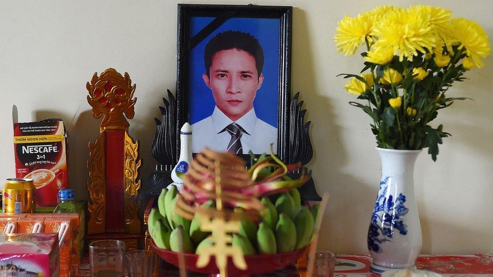 A portrait of Le Van Ha on a prayer altar at his house in Vietnam's Nghe An province