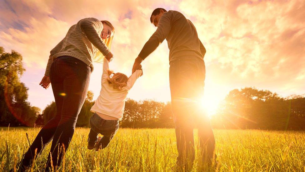 Parents and child posed by models