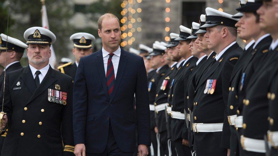 Prince inspects the honour guard at the Legislative Assembly in Victoria