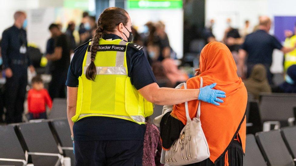 refugee-at-heathrow-airport.