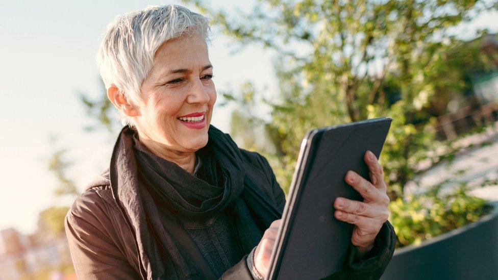 A woman using a tablet computer