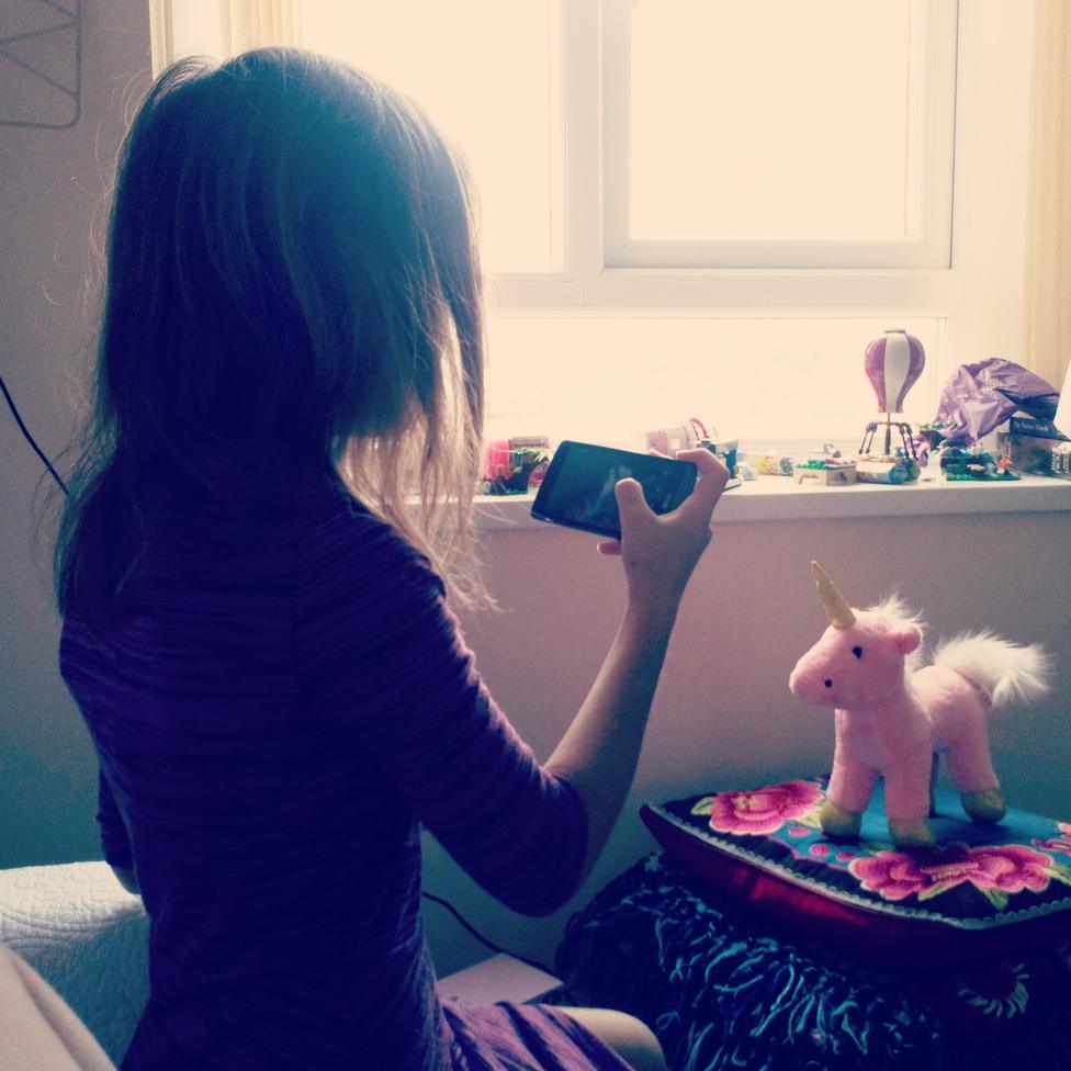 Tracy's daughter takes a picture of a pink unicorn