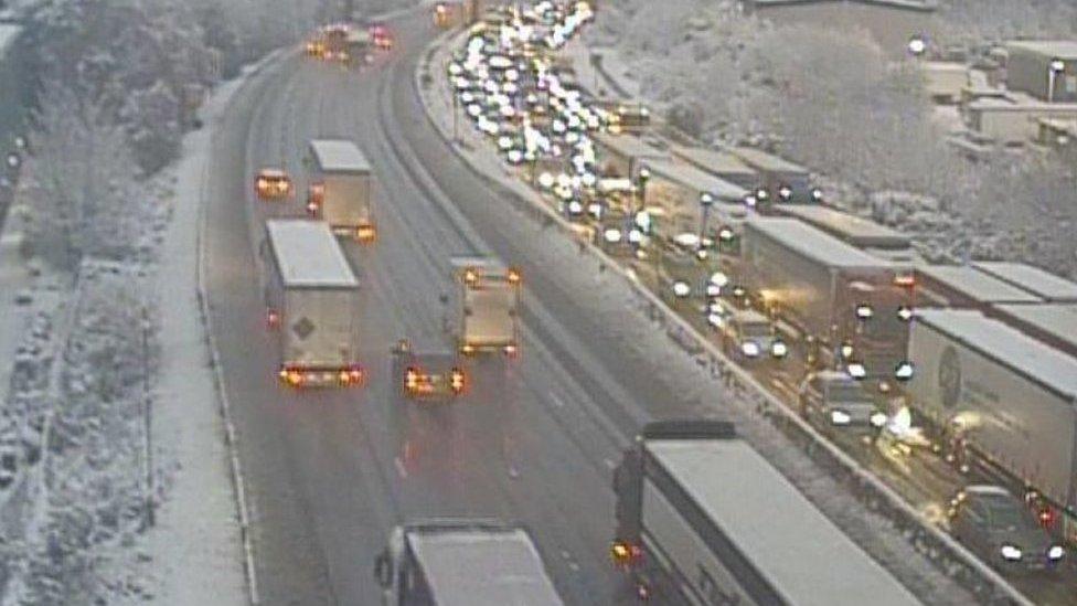 M25 between junction24 to 26 with traffic queuing due to snow and ice