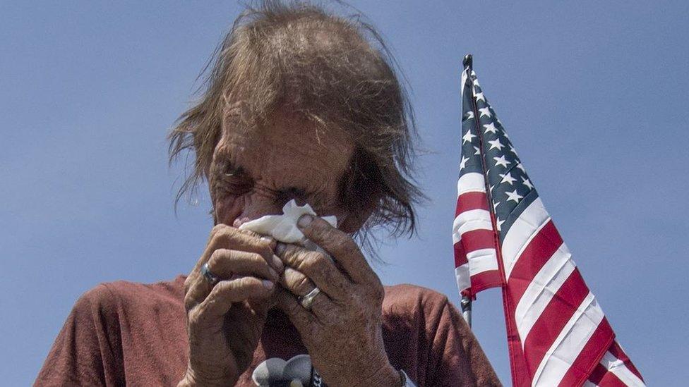 Antonio Basco breaks down at a makeshift memorial for his wife Margie Reckard who was killed in the El Paso shooting on August 5