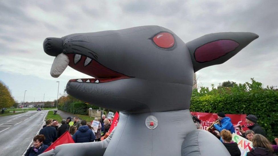 A huge inflatable rat at the protest