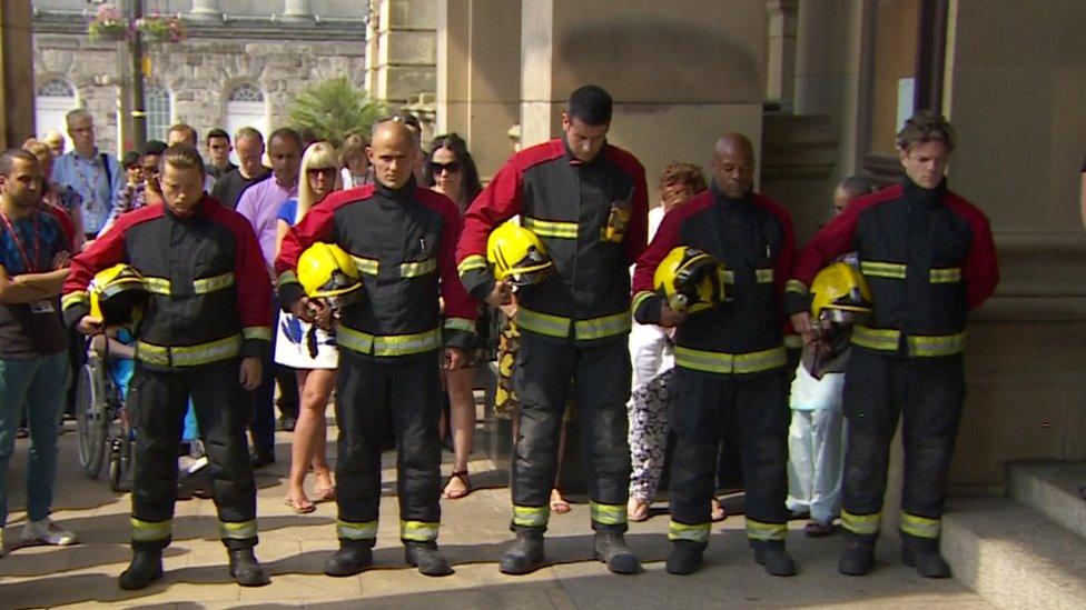 Firefighters observing the minute's silence