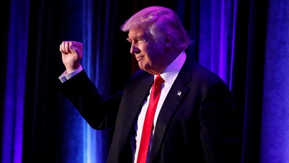 Donald Trump raises his fist