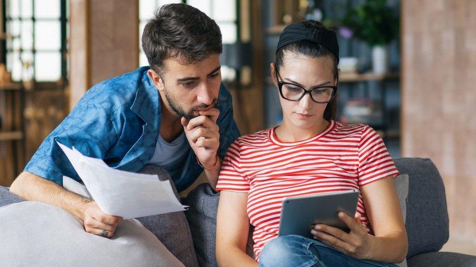 Couple looking at tablet computer