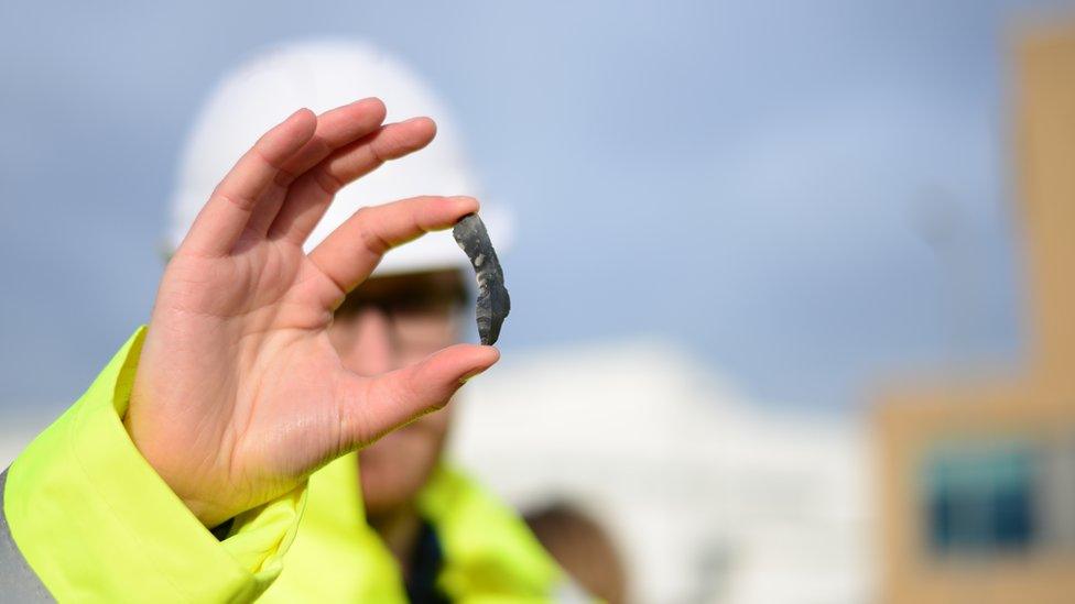 An archaeologist with a flint