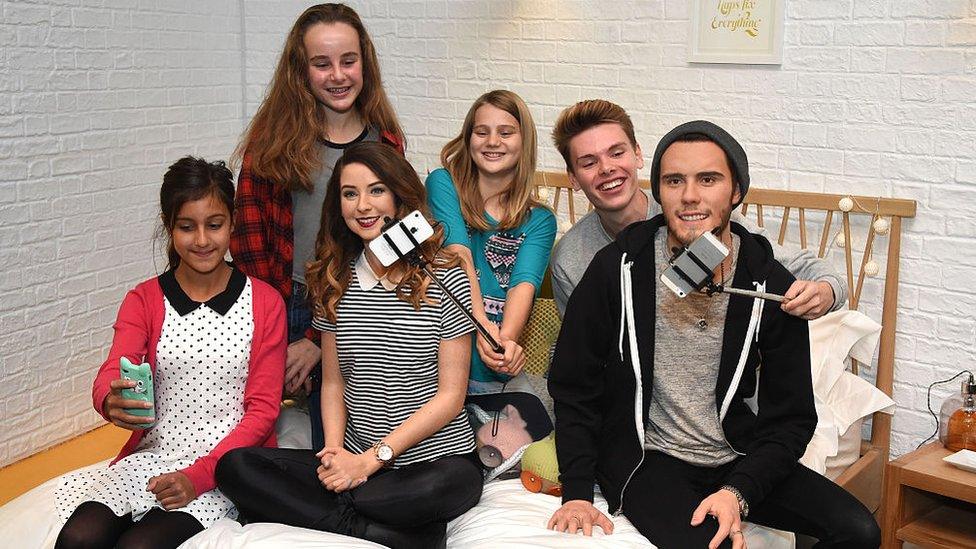 Zoe-Sugg-and-Alfie-Deyes-waxworks-on-display-in- London.