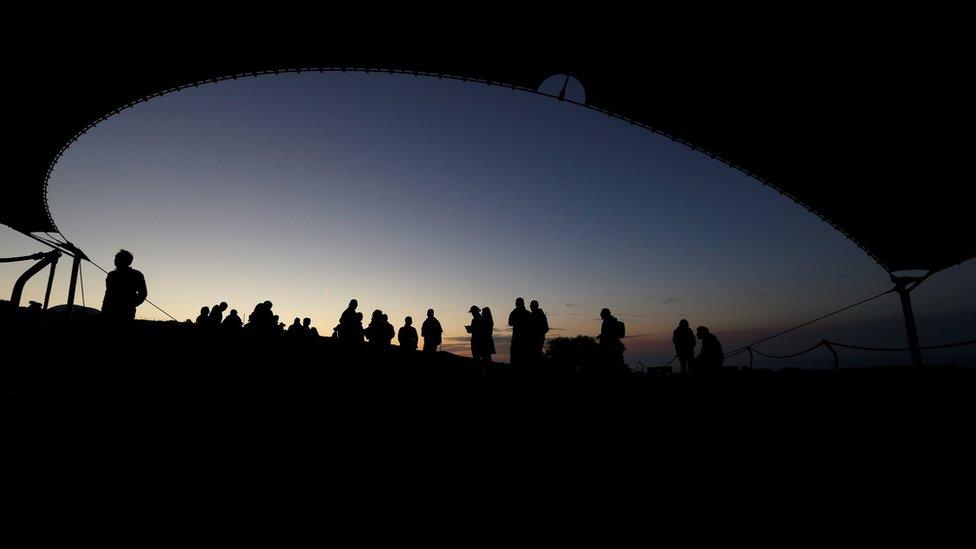 Visitors arrive to watch the sunrise at the megalithic Mnajdra Temples during the vernal equinox marking the beginning of Spring, outside Qrendi