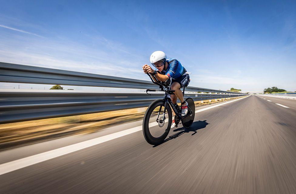 An athlete competes in the bike leg during the 2025 Ironman Emilia Romagna
