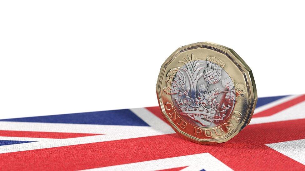 Pound coin on flag