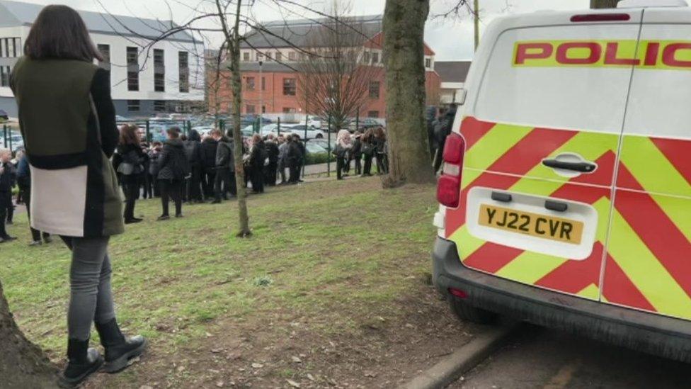 Pupils gathered outside The Farnley Academy, Leeds, on Monday