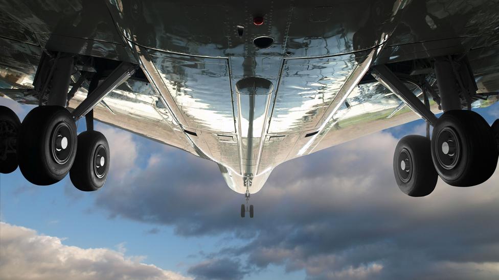 Undercarriage of large plane, flying