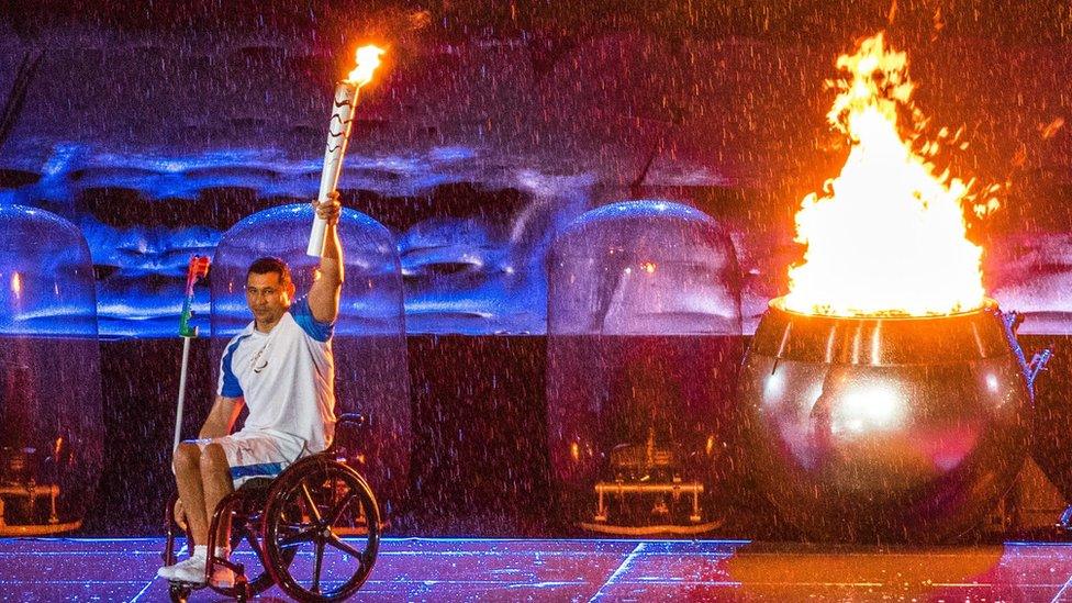 Brazilian Paralympic swimmer Clodoaldo Silva lights the cauldron during the opening ceremony of the Rio 2016 Paralympics Games at the Maracana Stadium in Rio de Janeiro, Brazil