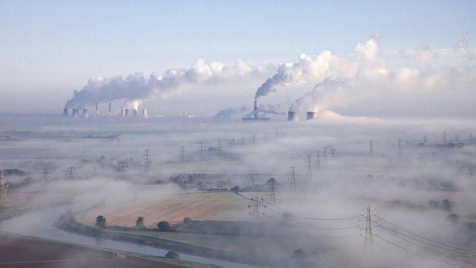 A-misty-morning-with-a-factory-in-the-background.