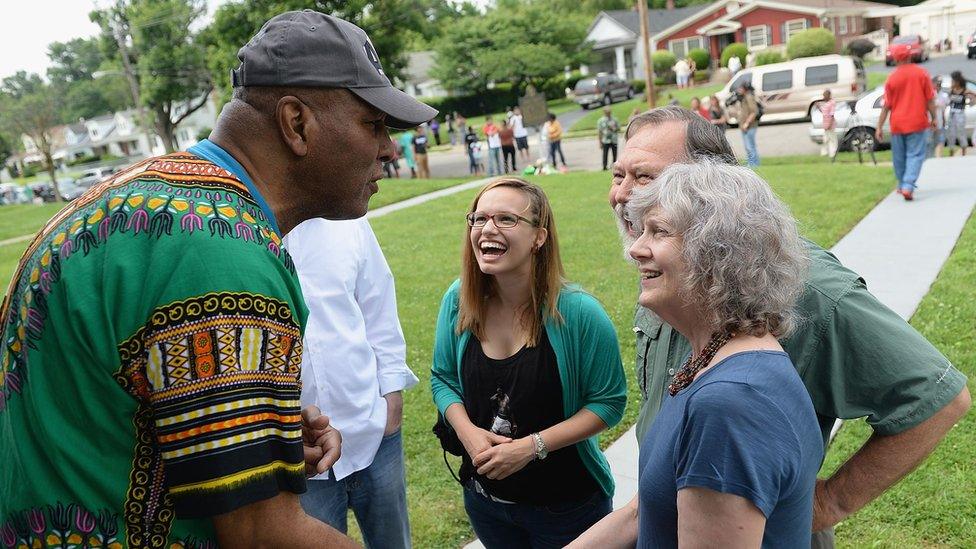 Rachmon Ali (L), brother of boxing great Muhammad Ali, greets visitors and well wishers outside the Muhammad Ali Childhood Home Museum on June 4, 2016 in Louisville, KY.