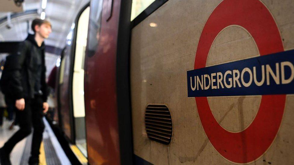 File photo of man boarding Tube carriage