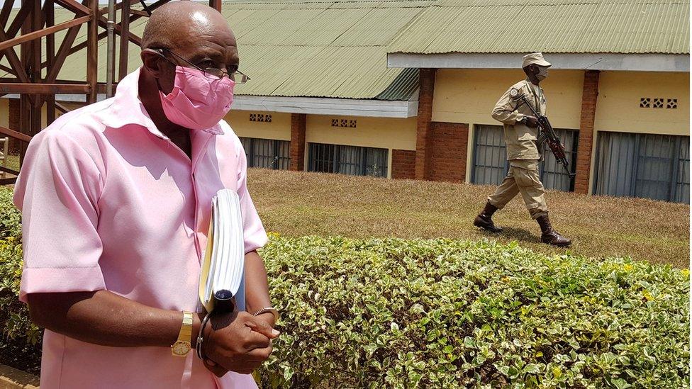 Paul Rusesabagina, portrayed as a hero in a Hollywood movie about Rwanda"s 1994 genocide, is escorted in handcuffs from the courtroom in Kigali, Rwanda September 25, 2020