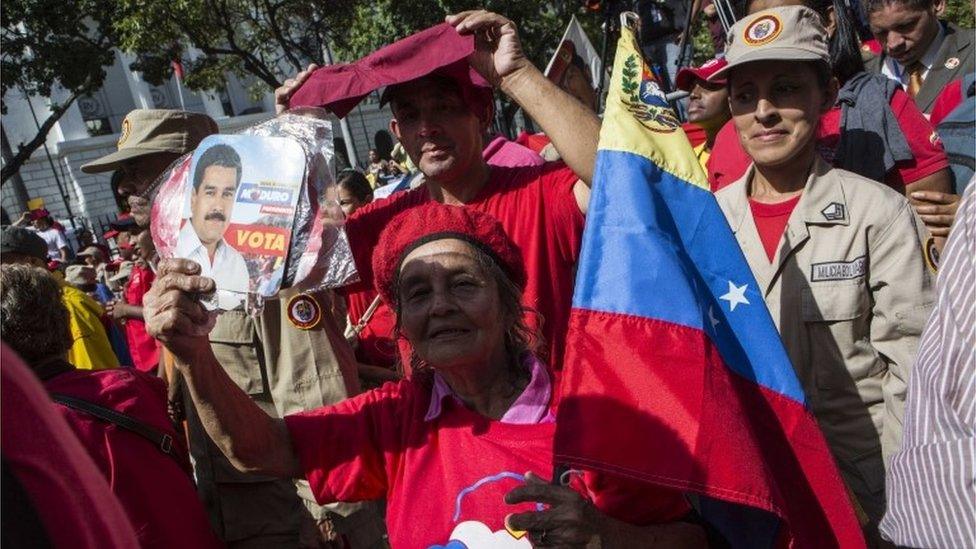 People participate in an "anti-imperialist" march in Caracas, Venezuela, 14 August 2017.