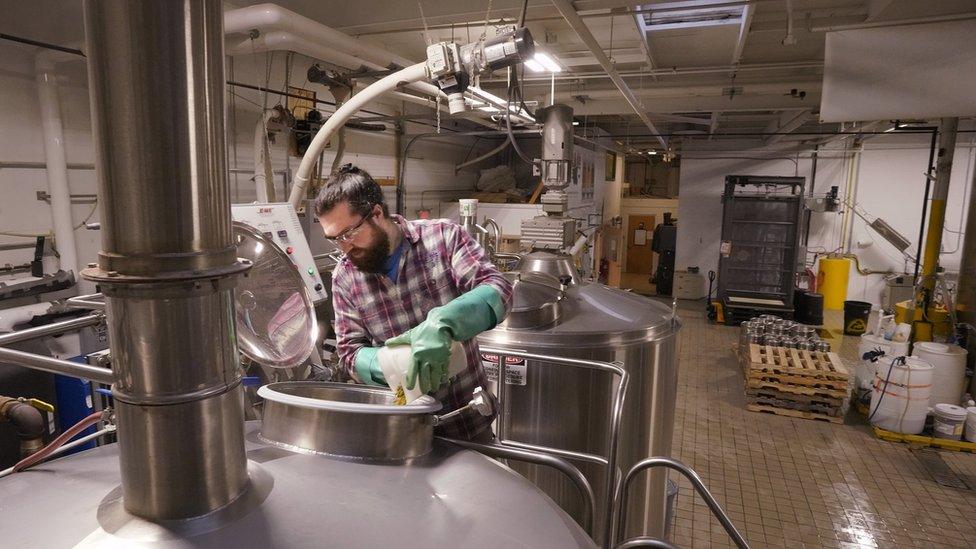 Brewer Mike O'Neal adds hops to a batch of Daymark at Rising Tide Brewing Company in Portland on Tuesday, January 8, 2019.