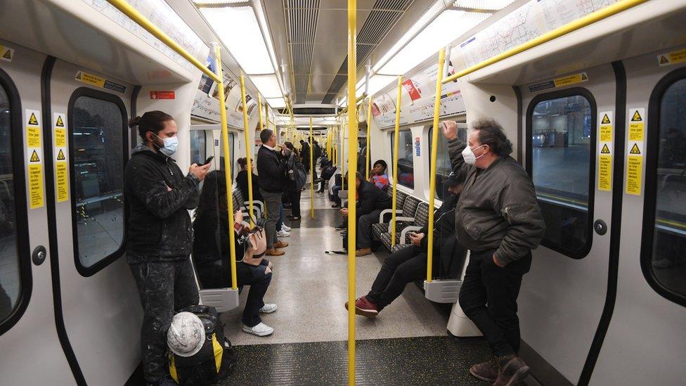 Commuters on their way to work in the London Underground in London,