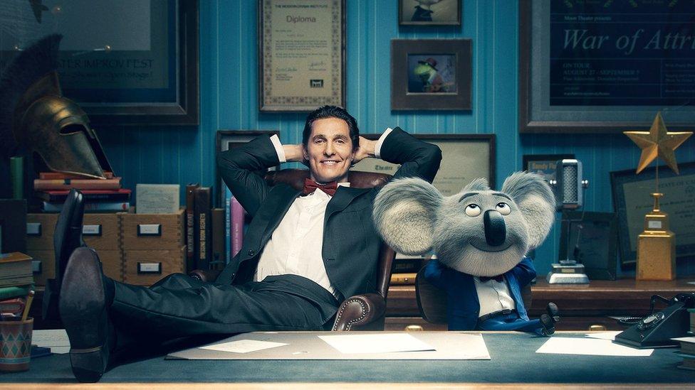 Matthew McConaughey with his animated character Buster Moon