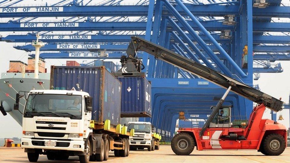 Containers being loaded at Tianjin port in China