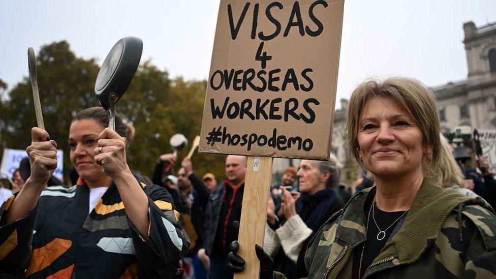 Hospitality workers demonstrate outside Parliament