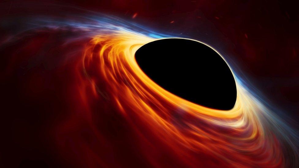 An artist’s impression depicting a rapidly spinning supermassive black hole surrounded by a disc of rotating material consisting of the leftovers of the destroyed star