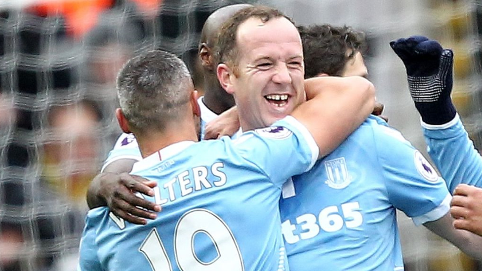 Charlie Adam is congratulated by his team-mates during Stoke City's win at Watford