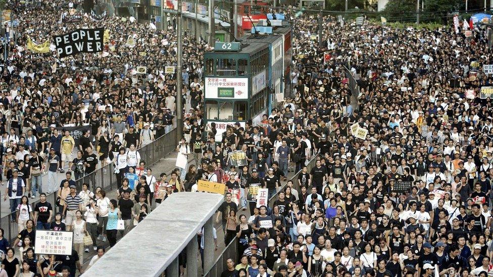 Protesters fill two streets during a rally against Article 23, 1 July 2003