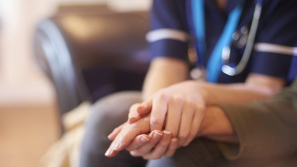 Nurse comforting patient