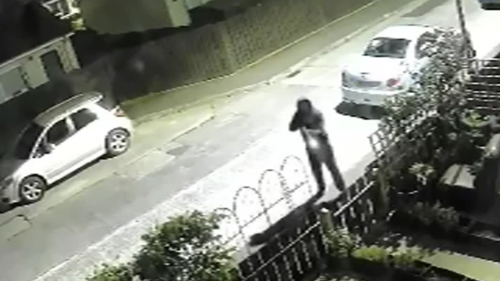 CCTV picture of man firing on house