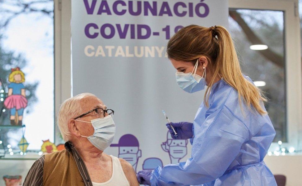 An elderly person receives the coronavirus disease vaccine at resident Gent Gran Creu, in Girona, Catalonia, Spain, 27 December 2020