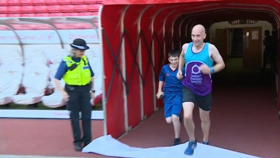 Scott Baker completing his final 10km run in the players' tunnel at the Stadium of Light, heading on to the pitch