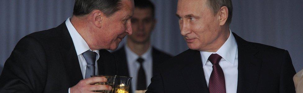 Russian President Vladimir Putin (R) and Sergei Ivanov (L)