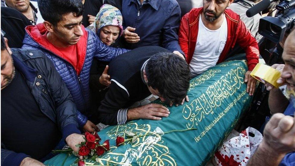 Relatives mourn over the coffin during the funeral for a victim of Saturday"s Ankara bomb attacks on 12 October 2015, in Istanbul, Turkey.