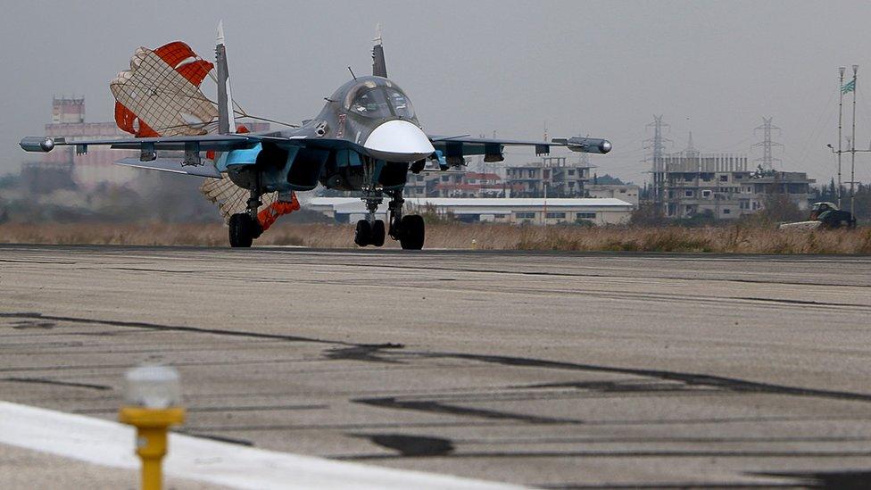 A Russian Sukhoi Su-30SM fighter jet lands at the Russian Hmeimim military base in Latakia province (16 Dec)