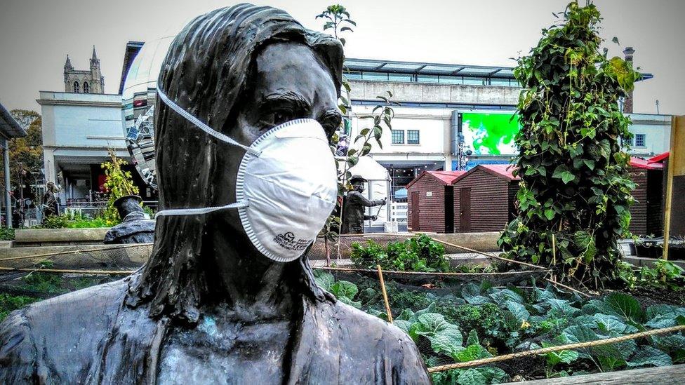 Statue in dust mask