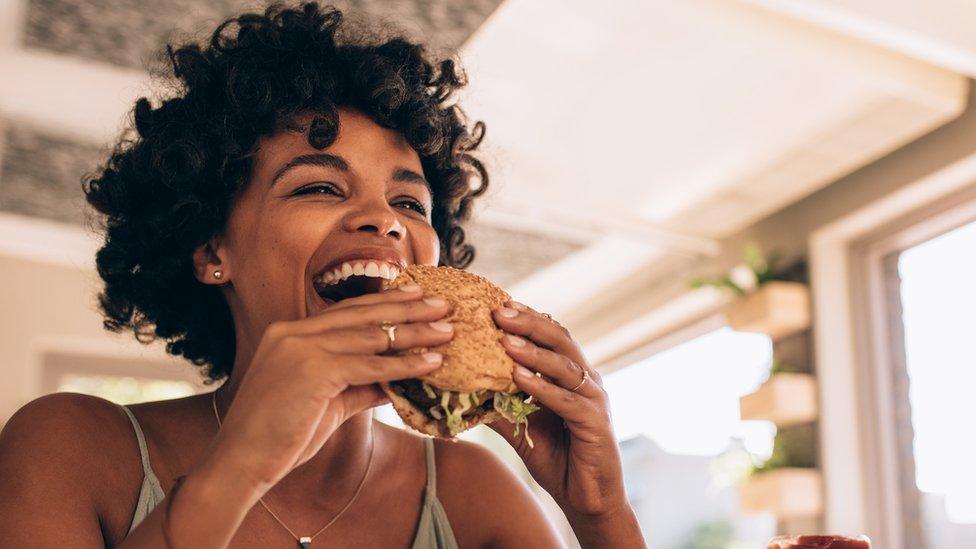 Woman eating a burger